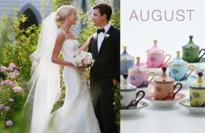 A bride in a white gown and veil stands with a groom in a black tuxedo near blooming flowers, gazing at each other. To the right, a collection of colorful, ornate teacups with lids is displayed. The word "AUGUST" is written above the teacups.