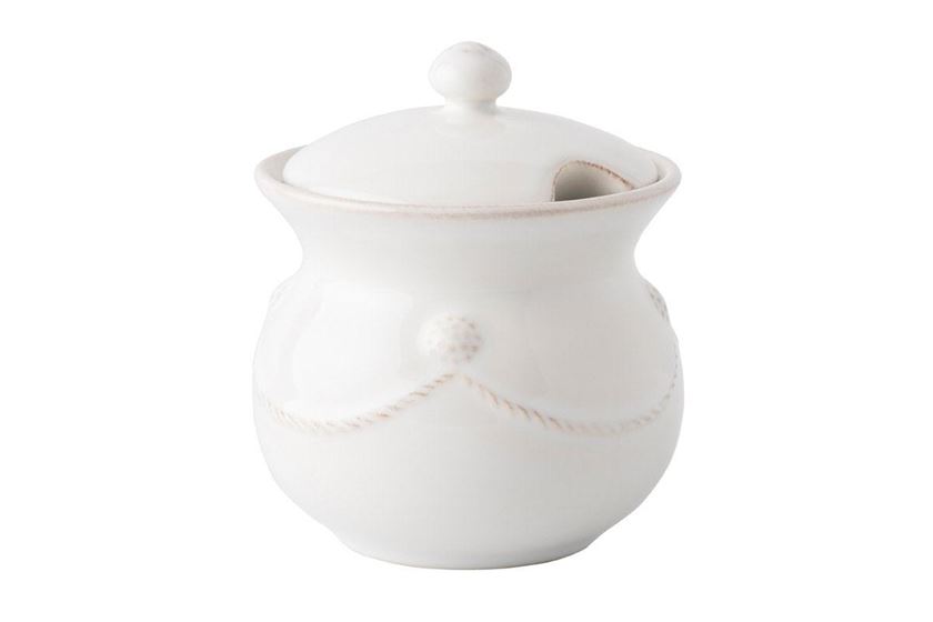Photo of a white sugar bowl with lid