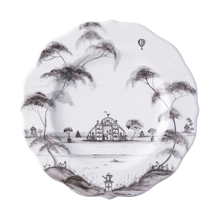 Photo of white plate with artistic tan trees and an estate drawn on the plate