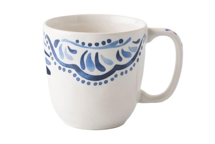 Photo of a white cup with blue artistic embelleshment