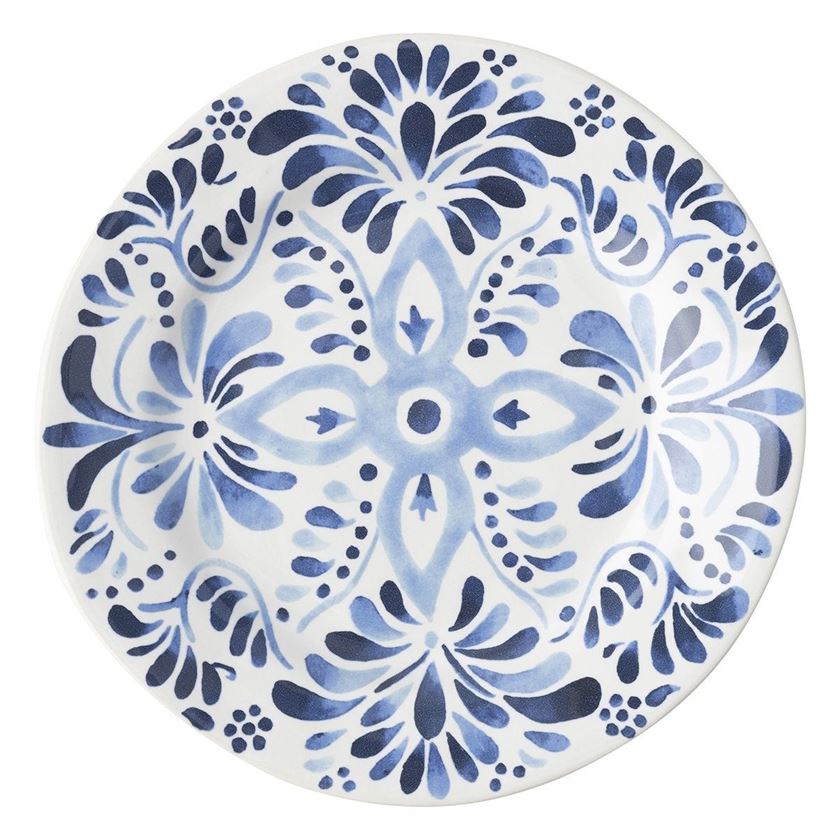 Photo of a white plate with blue artistic embelleshment on the sides