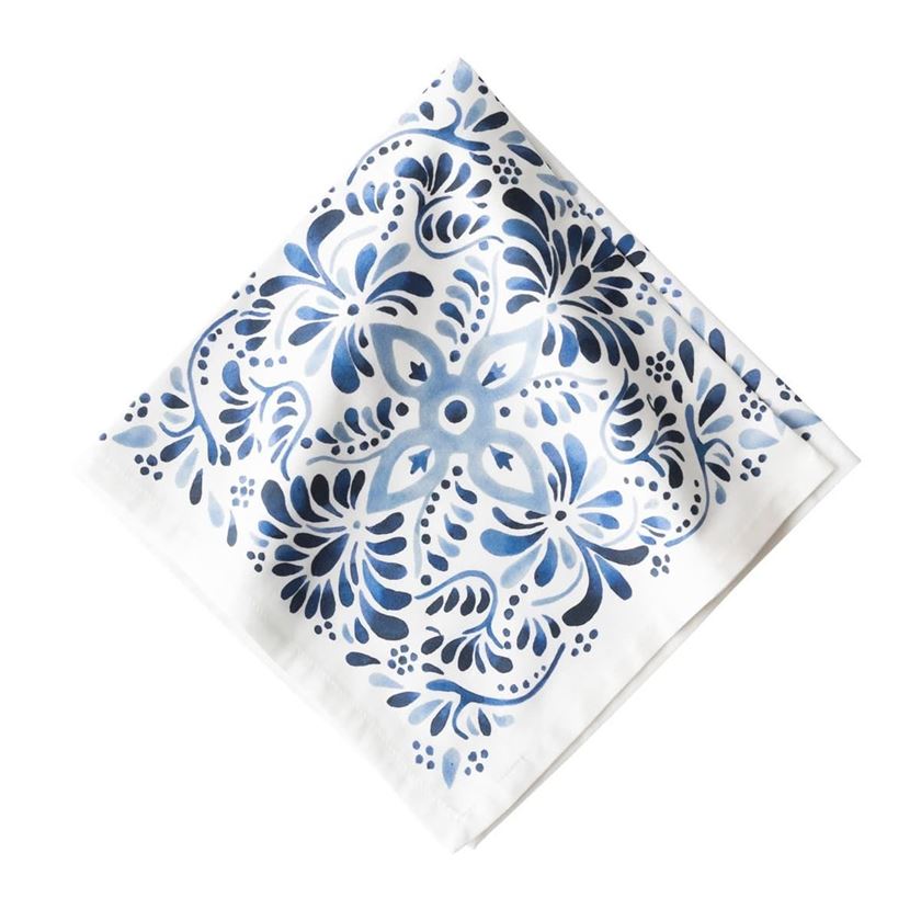 Photo of a white napkin with blue artistic embelleshments