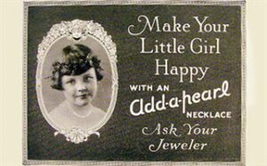 A vintage black and white advertisement features a young girl framed by an ornate oval border. Text reads, "Make Your Little Girl Happy with an Add-a-pearl Necklace. Ask Your Jeweler.