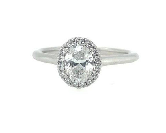 platinum round halo engagement ring with central round diamond