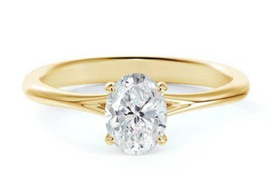 yellow gold oval engagement ring with diamond basket