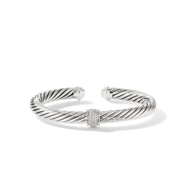 A silver-colored, twisted cable cuff bracelet with an open design. It features a center accent adorned with small, sparkling crystals. The bracelet ends with rounded, smooth caps and casts a slight shadow against the white background.