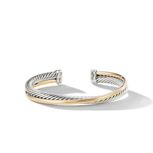 A sleek, open-ended cuff bracelet featuring intertwined silver and gold-toned twisted metal bands, displayed on a white background with a subtle shadow. The bracelet has polished ends, highlighting its elegant and modern design.