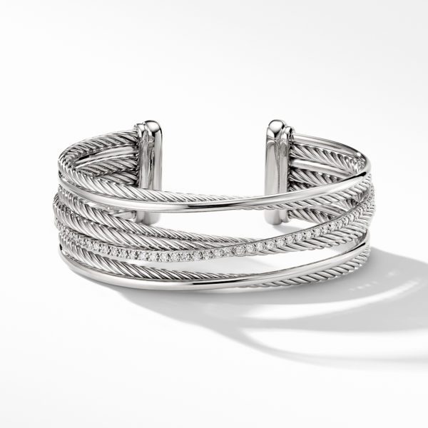 A silver cuff bracelet with a twisted rope design and a row of embedded diamonds running across the middle section. The bracelet features an open-ended cuff style, casting a shadow on a white background.