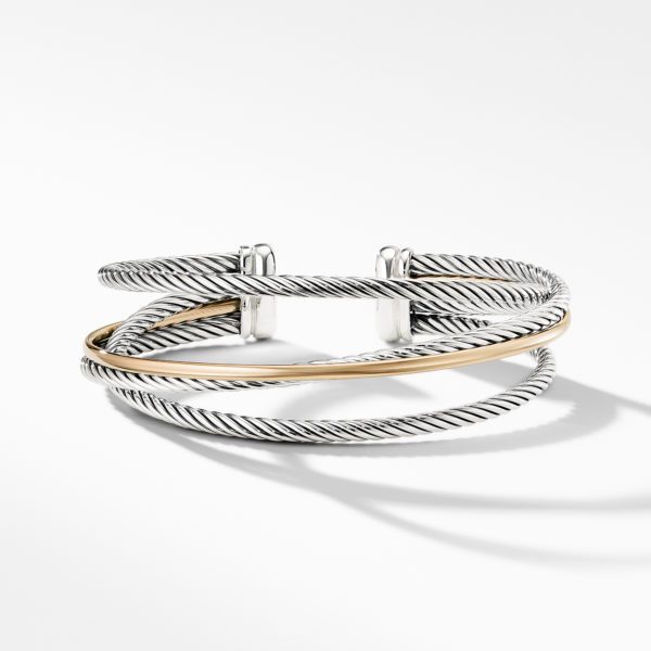 A stylish silver and gold cable bracelet featuring intertwined, twisted strands. The bracelet's design combines a silver-toned twisted cable with a smooth gold-toned band, set against a white background with a soft shadow.