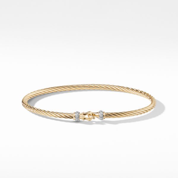 A gold twisted rope bracelet with a clasp closure, accented by two small bands of diamonds near the clasp, shown against a plain white background.