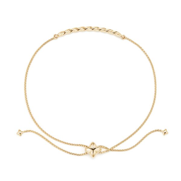 A delicate gold bracelet with a thin chain and a central charm featuring a four-petal flower design. The bracelet has an adjustable sliding clasp with two small gold beads at the ends of the chains.