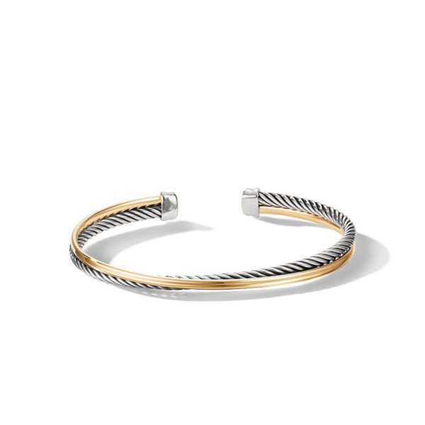 A stylish open cuff bracelet featuring a dual-tone design. It has one twisted metallic strand and another smooth gold-colored band running parallel. The ends of the bracelet are capped with silver-toned tips, creating a sophisticated and modern look.