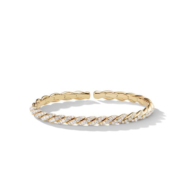 A gold bracelet with a twisted rope design, partially encrusted with small, sparkling diamonds along the front half, set against a white background. The bracelet is open-ended with a sleek, polished finish.