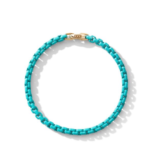 An elegant turquoise bracelet with a gold clasp. The bracelet has a woven design, and the clasp features the initials "DY." The bracelet is displayed on a white background, casting a faint shadow.