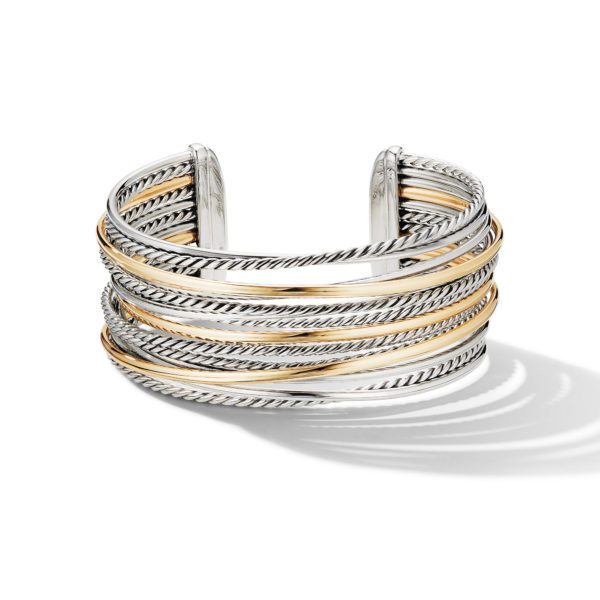 A stylish open cuff bracelet featuring multiple intertwined bands of silver and gold tones. The design includes alternating textured and smooth segments, creating an elegant, layered appearance. The bracelet is photographed against a plain white background.