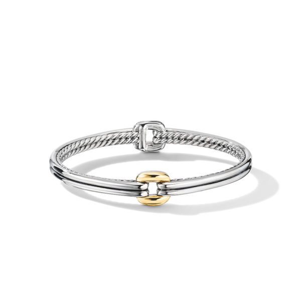 A sleek silver bracelet with a cable pattern and a subtle gold accent in the middle, showcased against a plain white background. The design highlights a polished and elegant appearance.