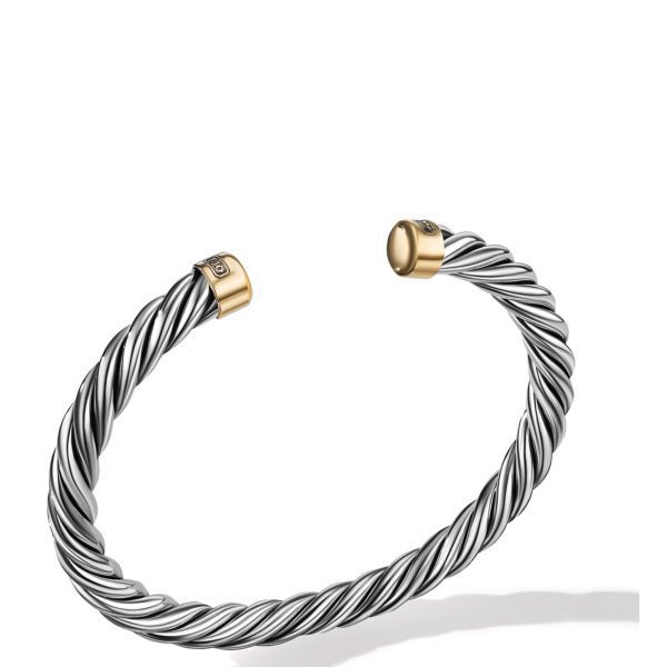 A twisted rope-style cuff bracelet with open ends, featuring silver and gold tones. The bracelet's tips are capped with polished gold-colored metal and bear a small emblem. The main body has a shiny, twisted design, giving it a sleek, modern look.