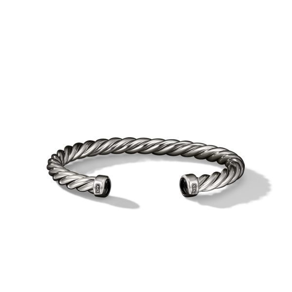 A twisted silver cuff bracelet with tapered, open ends is pictured against a white background. The design features a rope-like texture, and the ends are capped with smooth, rounded detail.