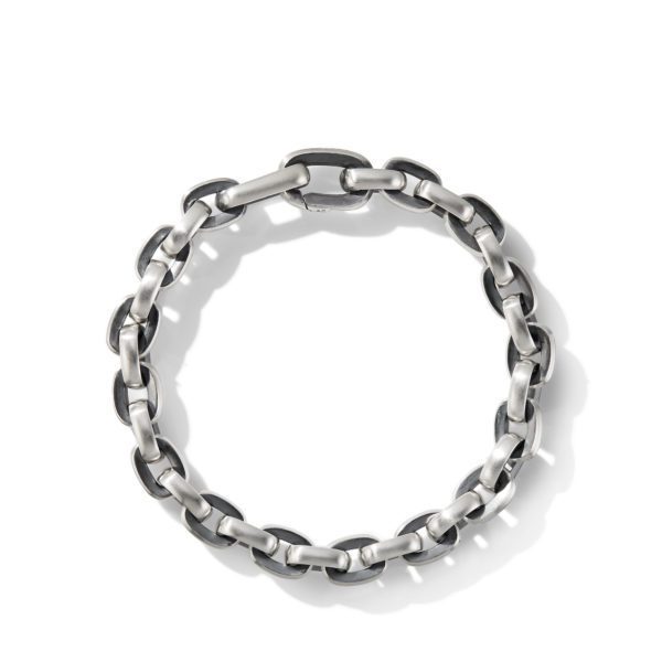 A silver chain bracelet with large, smooth, oval links arranged in a circular pattern against a plain white background. The links alternate between slightly darker and lighter shades, giving the bracelet a polished, stylish appearance.