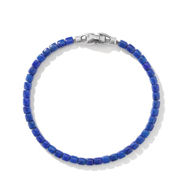 A bracelet consisting of small, square, dark blue beads strung closely together. The bracelet features a sleek silver clasp at the top, designed for secure fastening. The beads have a shiny, polished surface, and the background is plain white.