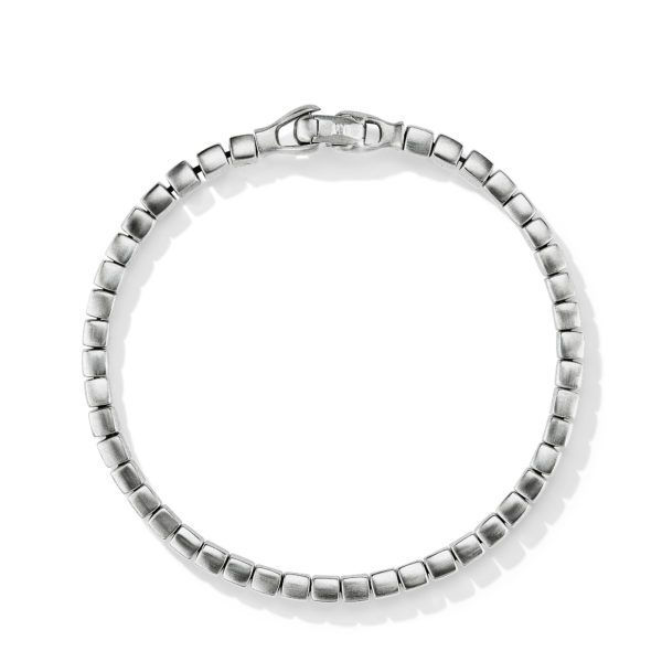 A silver bracelet composed of square-shaped links arranged in a circular pattern. The bracelet features a sleek, polished finish and is secured by a clasp, visible at the top of the circle. The bracelet rests on a plain white background.