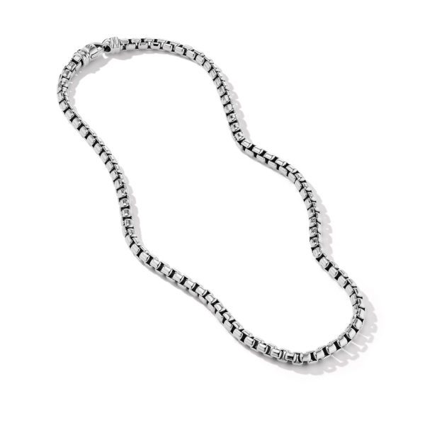 A silver square box chain necklace is displayed against a plain white background. The necklace features evenly spaced interlocking square links, creating a sleek and modern appearance.