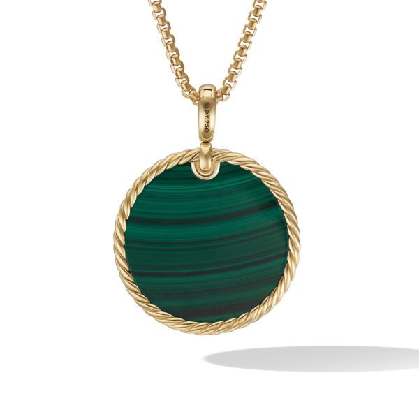 A gold pendant necklace featuring a round green malachite stone encircled by a twisted gold rope design. The pendant hangs from a medium-length gold chain. The malachite stone has dark and light green bands, and the design is modern and elegant.