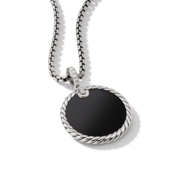 A silver necklace with a circular black pendant. The pendant features a twisted silver rope-like border and a diamond-studded bale connecting it to the chain. The necklace is displayed against a plain white background.