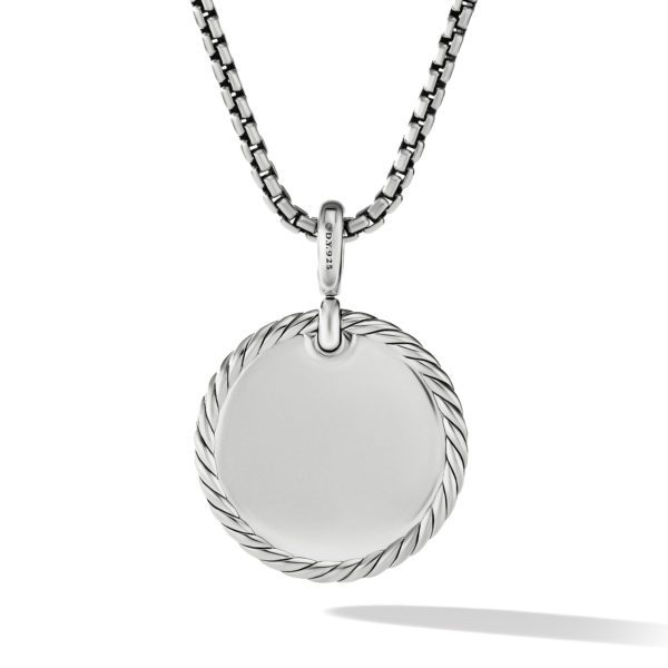 A silver pendant necklace featuring a circular medallion with a rope-textured edge on a box chain. The bail connecting the chain to the pendant is engraved with lettering. The necklace is displayed against a white background with a subtle drop shadow.