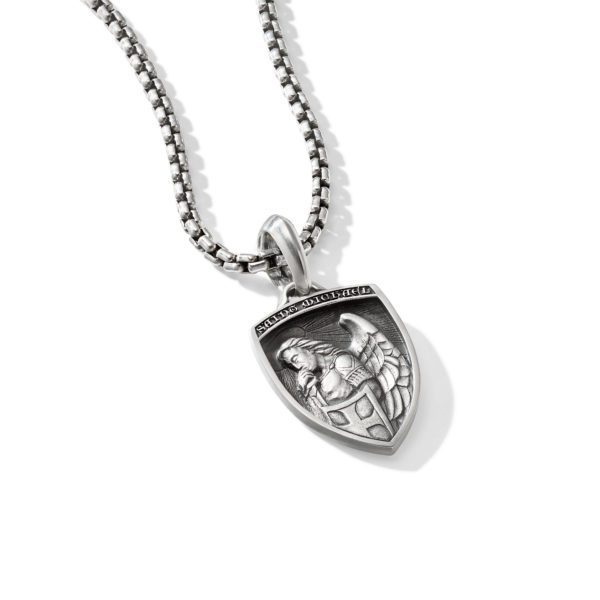 A silver shield-shaped pendant hangs on a chain necklace. The pendant features an intricately detailed engraving of an armored knight holding a sword and shield, with the Latin words "SAPIENTIA · VICTORIA" inscribed along the top edge.