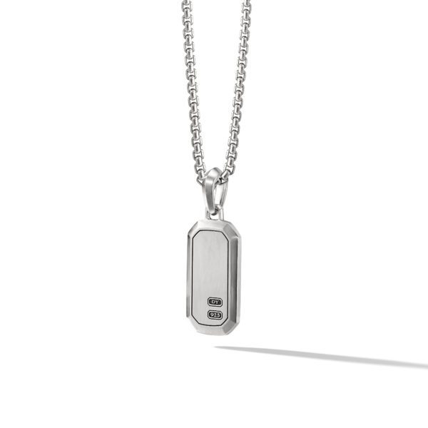 A silver chain necklace with a rectangular pendant featuring slightly rounded corners. The pendant has two small rectangles with indiscernible markings etched near the bottom. The necklace casts a small shadow on a white background.