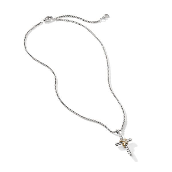 A silver necklace with a cross pendant. The cross has a twisted design, combining silver and gold elements. The necklace chain is thin and features a small clasp at the end. The image is set against a white background.