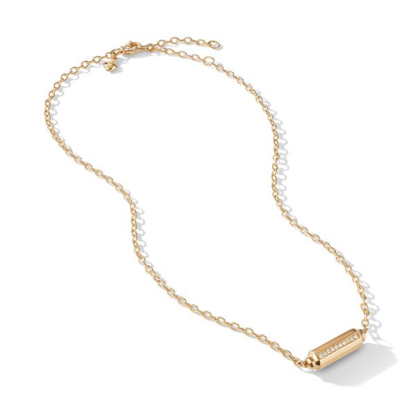 A gold chain necklace featuring a cylindrical pendant adorned with small, sparkling gemstones. The chain includes an adjustable clasp for length variation. The necklace is displayed against a plain, light-colored background.