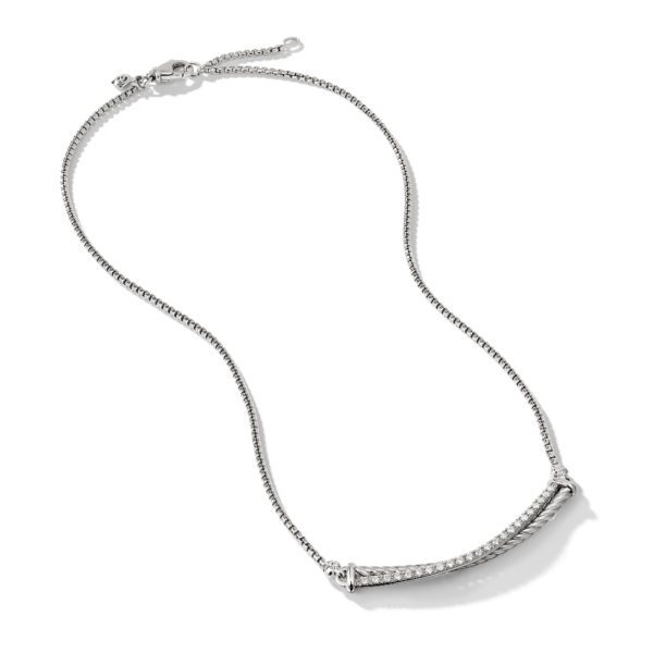 A silver chain necklace featuring a rectangular bar encrusted with small, sparkling gems. The chain has fine links and an adjustable clasp at one end. The rectangular bar is slightly curved, adding an elegant touch to the minimalist design.