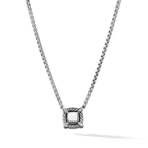 A photo of a silver necklace with a box chain and a square pendant. The pendant features engraved details and the marking "D Y 925" indicating sterling silver. The background is white, showcasing the necklace with a slight shadow below.