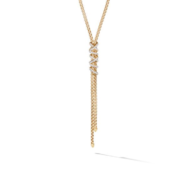 A gold lariat necklace featuring a vertical drop adorned with sparkling diamonds. The design includes two thinner chains hanging downwards, creating an elegant and luxurious look against a plain white background.