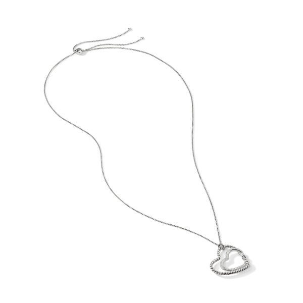 A delicate silver necklace featuring a thin chain with an adjustable clasp. The pendant is a twisted, open heart shape. The necklace is displayed against a plain white background.