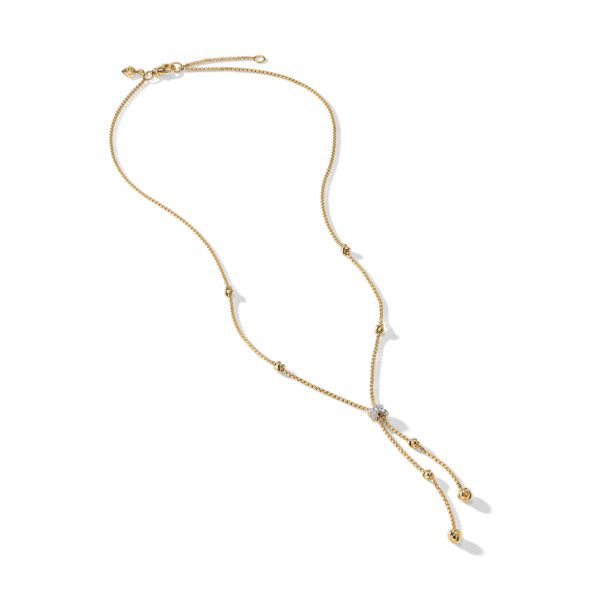 A delicate gold chain necklace with small round beads spaced along its length. The chain features a Y-shaped drop with two dangling ends, each adorned with additional beads and a tiny gem at the tips. The necklace is shown on a white background.