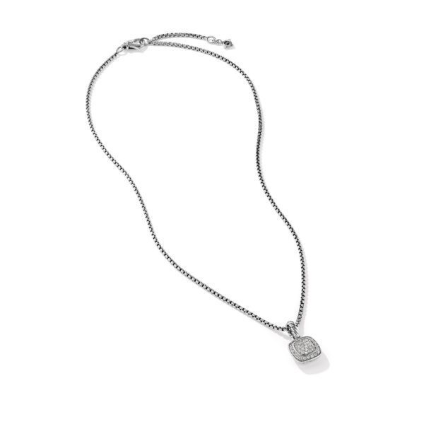 A delicate silver chain necklace featuring a small, square-shaped pendant with a slightly rounded frame, adorned with tiny shimmering stones. The chain has an adjustable clasp at the end for length customization. The pendant hangs gracefully at the center.