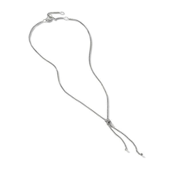 A silver lariat necklace with a delicate chain. It features an adjustable length with two strands hanging down, each ending with a small, round, silver charm. The clasp and extender chain are visible at the top.