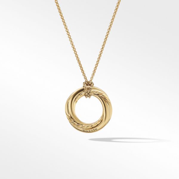 A gold necklace features an open circular pendant with intertwined rope and smooth textures, hanging on a delicate chain. The pendant is engraved with the text "Au750" at the bottom, indicating its gold purity. The background is plain white, highlighting the jewelry.