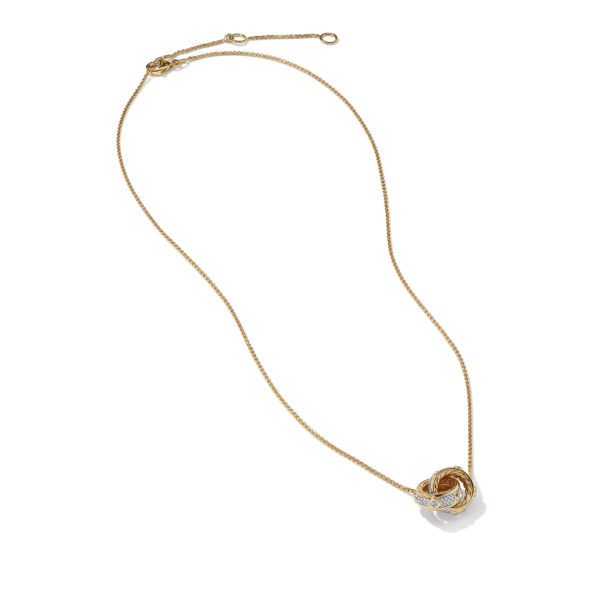 A delicate gold chain necklace with a decorative pendant featuring intertwined gold and white gold loops. The necklace is laid out against a plain white background.