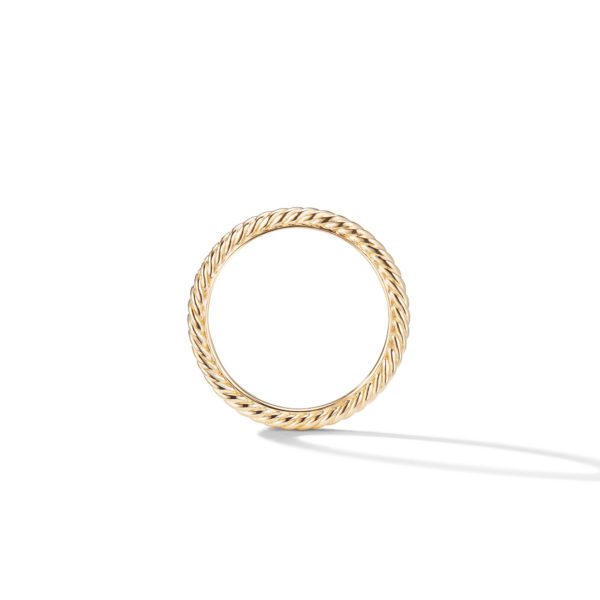 A gold ring with a twisted rope design, shown against a white background. The ring casts a small shadow to the right, highlighting its elegant craftsmanship and shiny texture.