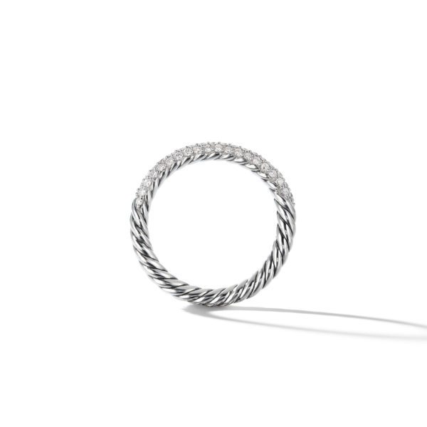 A silver ring with a twisted rope design is positioned upright against a white background. The top half of the ring is encrusted with small, sparkling diamonds. A faint shadow is cast beneath the ring.