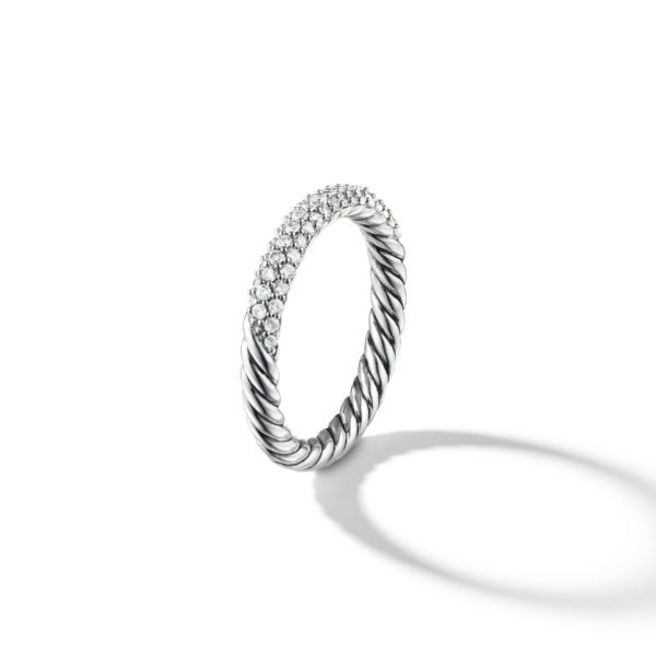 A silver twisted band ring with a half-circle of small, round diamonds set into one side. The ring is photographed against a plain white background with a soft shadow cast to one side.