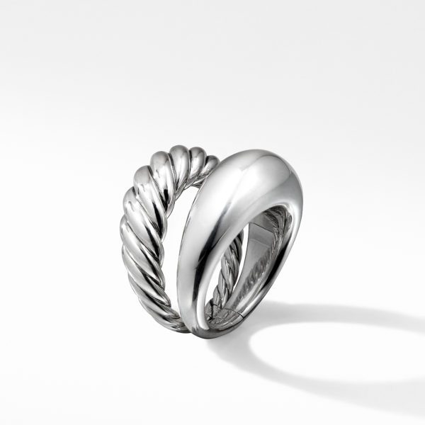 A silver ring featuring a twisted rope-like design on one half and a smooth, polished surface on the other half. The ring is standing upright against a plain white background, casting a faint shadow.