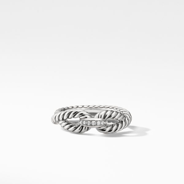 A silver twisted rope ring featuring a horizontal row of small, sparkling gemstones at the center, displayed on a plain white background. The ring's intricate rope-like design adds a touch of elegance and texture.