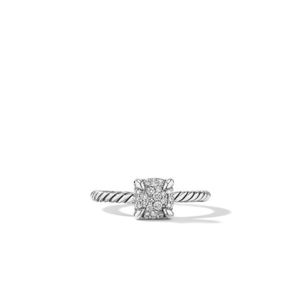 A silver ring with a twisted band and a square cluster of small diamonds set in the center. The ring is displayed against a plain white background, casting a subtle shadow.