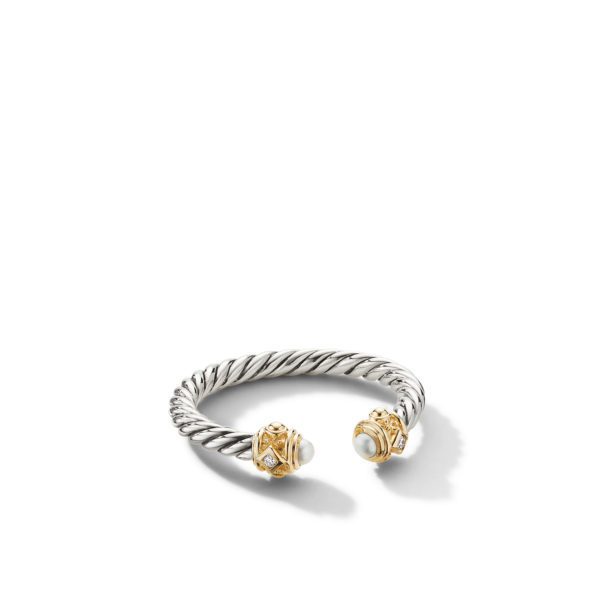 A silver twisted rope-style bracelet with open ends, each end adorned with a gold ornate cap and a white pearl. The bracelet is shown against a plain white background.