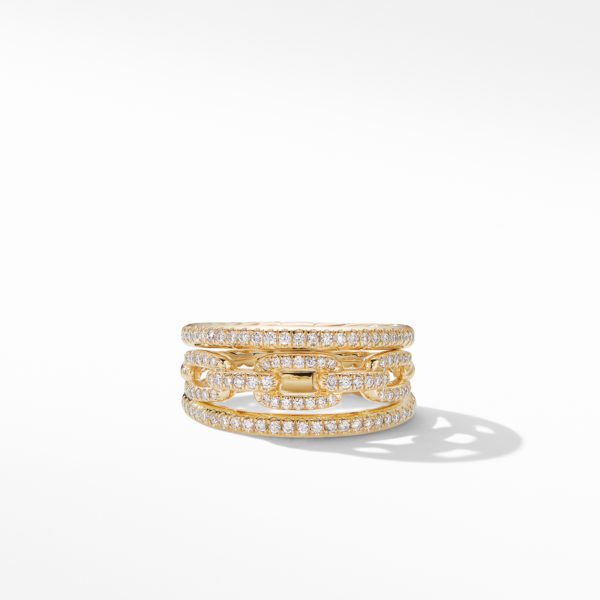 A gold band ring designed with three interconnected rows of small, round-cut diamonds set in a chain-link style, creating an elegant and intricate pattern. The diamonds and gold shine brightly against a white background.